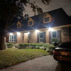 An exterior lighting project with a ladder visible, completed by Light of the World Electric in Lake City, FL.