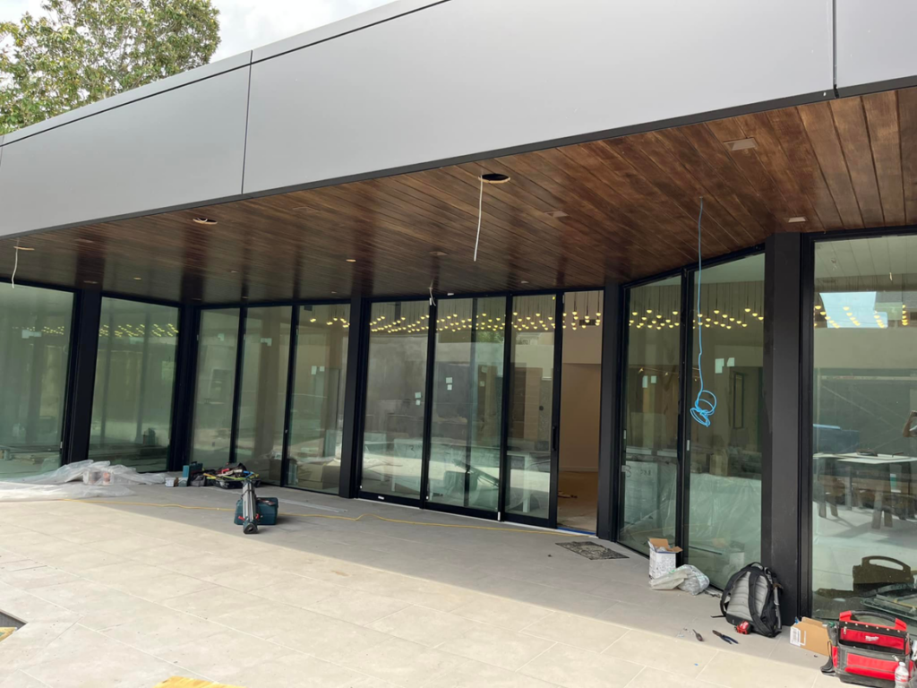Exterior view of a building with exposed wiring for lighting installation by Krajcer Electric in New Orleans, LA