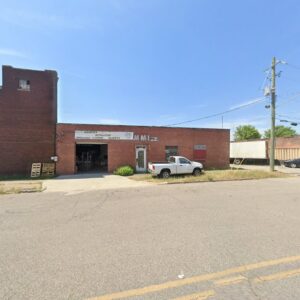 Exterior view of Milimar Marketing Inc. building with a sign for carpet installation services in Birmingham, AL.