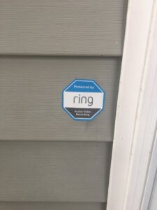 An exterior motion sensor floodlight installed on a house by Clarity Handyman Service in Raleigh, NC