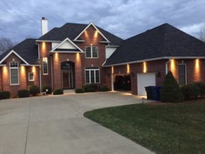 Exterior soffit lighting installation on a brick home by Crandall Home Solutions, LLC in Bloomington, IN.