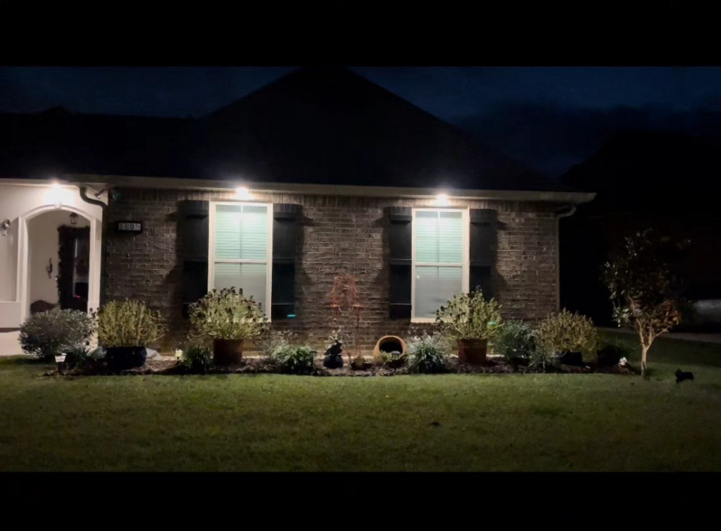 Newly installed exterior soffit lighting illuminating a home by Light of the World Electric in Lake City, FL.