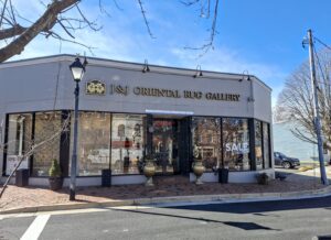 The exterior storefront of J and J Oriental Rug Gallery, a carpet contractor in Alexandria, VA.