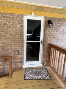 An exterior wall light fixture installed next to a door by C. C. Taylor Electric LLC in Powhatan, VA.