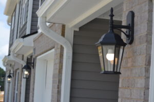 Exterior wall sconces installed on a new construction home by Precision Electric and Lighting Services, LLC in Olive Branch, MS.