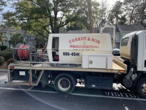 A Canady & Son Exterminating truck equipped with pest control gear parked in Wilmington, NC, ready for service.