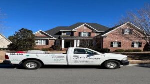 A Canady & Son Exterminating truck parked in front of a residential home, ready for a pest control job in Wilmington, NC.