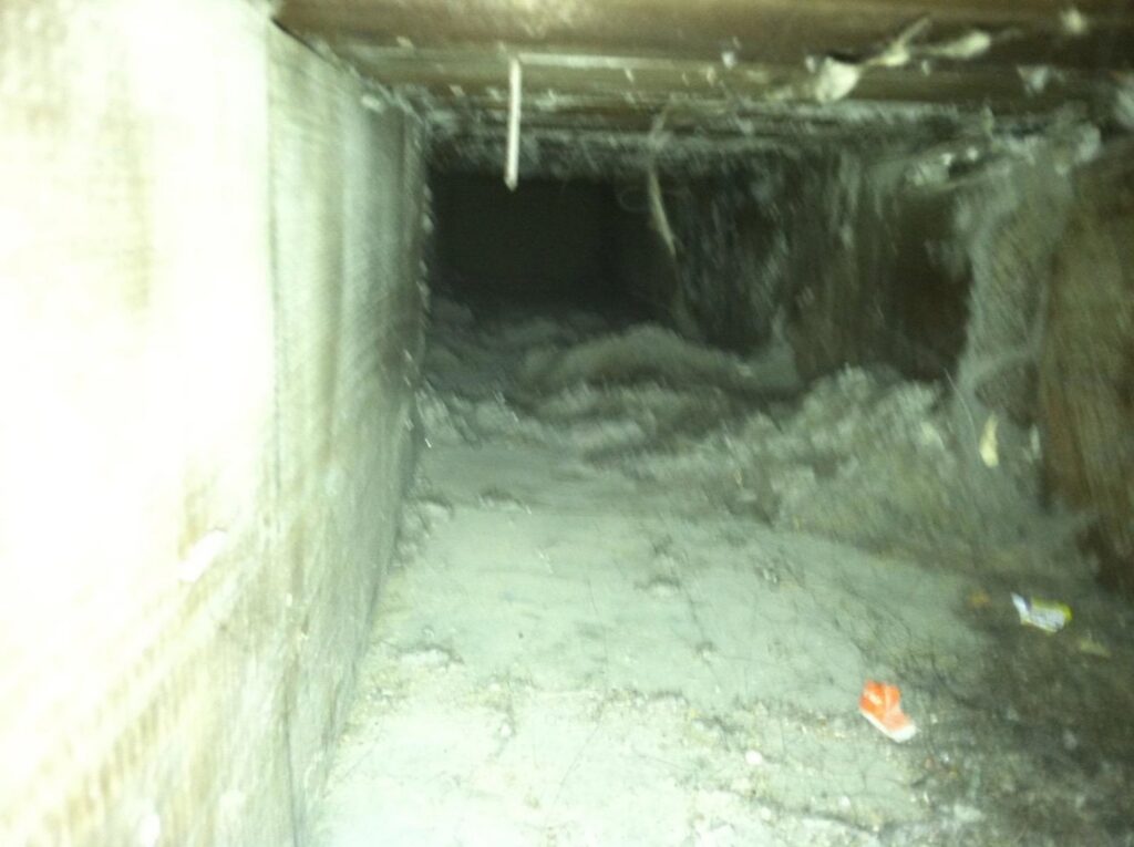 An extremely dirty air duct interior, highlighting the need for professional cleaning from Midwest Air Solutions in Indianapolis, IN