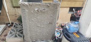 An extremely dirty outdoor air conditioning unit coil needing professional cleaning from Nelke Mechanical in Keizer, OR.