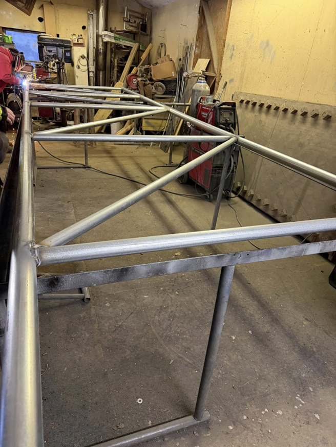 A newly fabricated metal fence gate frame in a workshop by Wayside Fences in Brattleboro, VT.