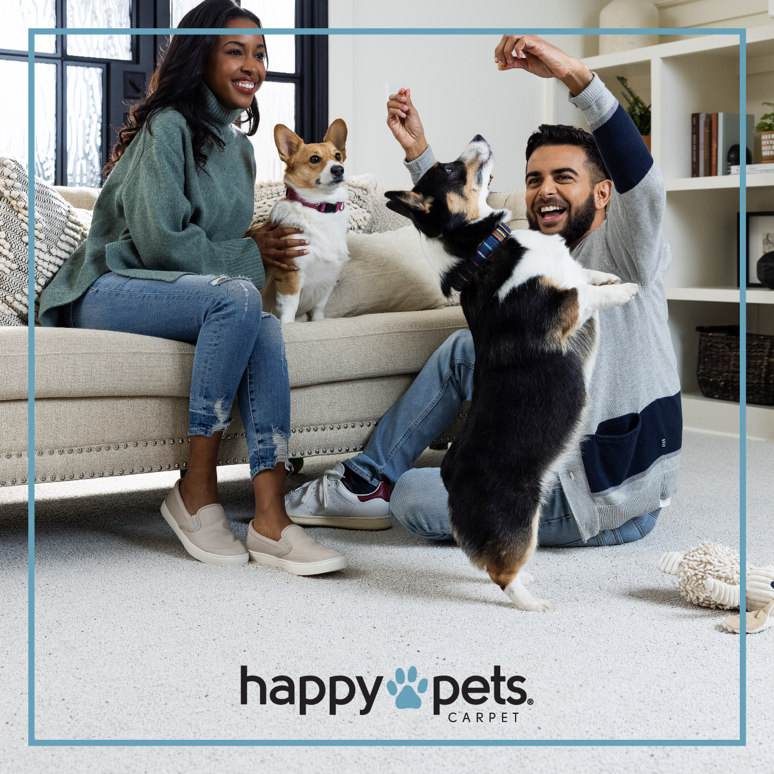 A family with two dogs enjoying their light-colored carpet flooring from Carpets Plus Cabinets Plus in St. Louis, MO.