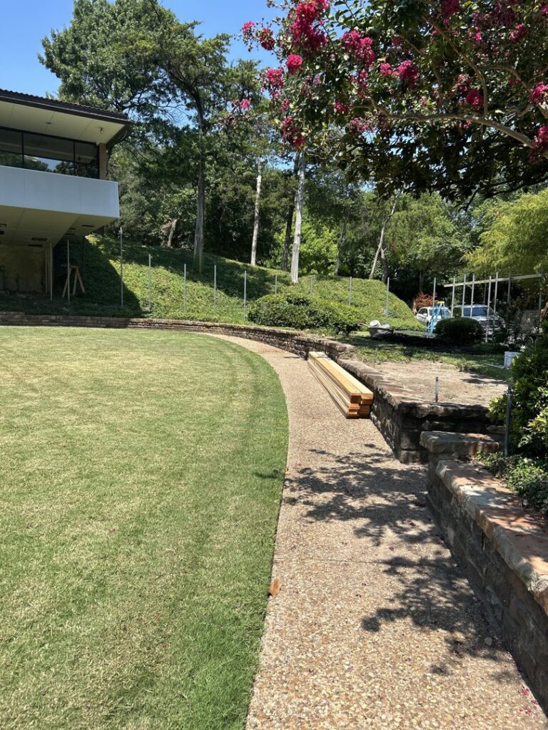 Metal fence posts being installed for a new fence project by EverFence in Dallas, TX.