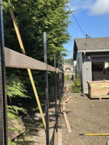 Fence posts and horizontal rails being installed for a new fence project by RPB Fence in Salem, OR