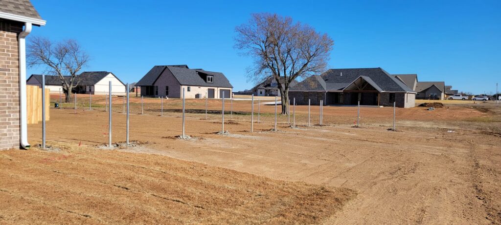 Fence posts installed for a new fence project by Veteran Fence Company LLC in Shawnee, OK.