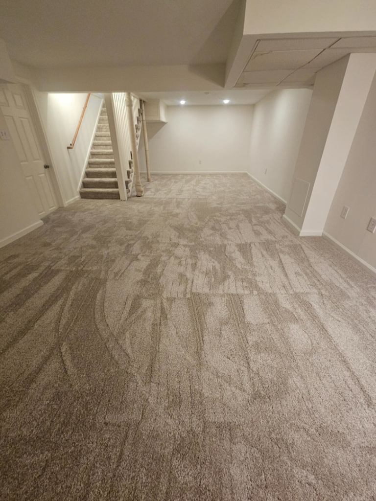 A finished basement with new carpet installation and a carpeted staircase by Carpets Mostly in Indianapolis, IN