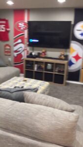 A newly carpeted basement living room, showcasing a completed installation by Mozak's Floors & More in Yankton, SD