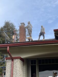 A finished brick chimney rebuild with a new cap, demonstrating expert service from Five Star Chimney Repair in Hillsboro, OR.
