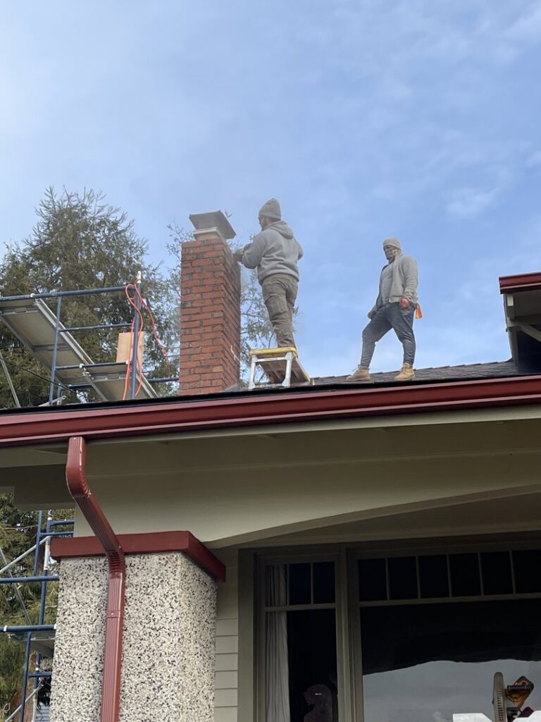 A finished brick chimney rebuild with a new cap, demonstrating expert service from Five Star Chimney Repair in Hillsboro, OR.