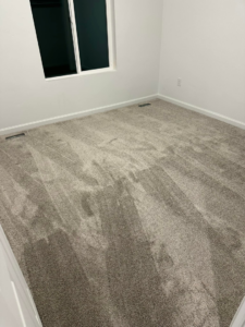 A finished grey carpet installation in a room by Millennium Flooring .Co in Salt Lake City, UT.