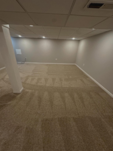 A spacious room featuring newly finished carpet with distinct vacuum patterns by Ordonez Flooring and Installation in Lewis Center, OH.