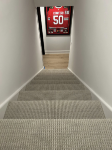 View of a completed carpet installation on a residential staircase by Creative Carpet Solutions LLC in Houston, TX.