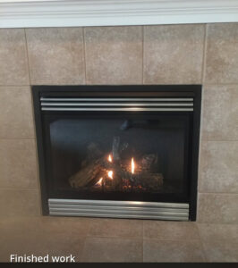 A newly installed gas fireplace with active flames, labeled 'Finished work' by Precision Energy LLC in Everett, WA.
