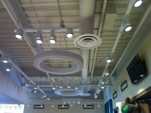 Finished interior ceiling showing HVAC diffusers and exposed ductwork installed by 1st Team Air Conditioning in Anaheim, CA