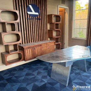 A newly installed blue patterned carpet in a modern office space by Floored Solutions and Services, LLC in Orlando, FL.