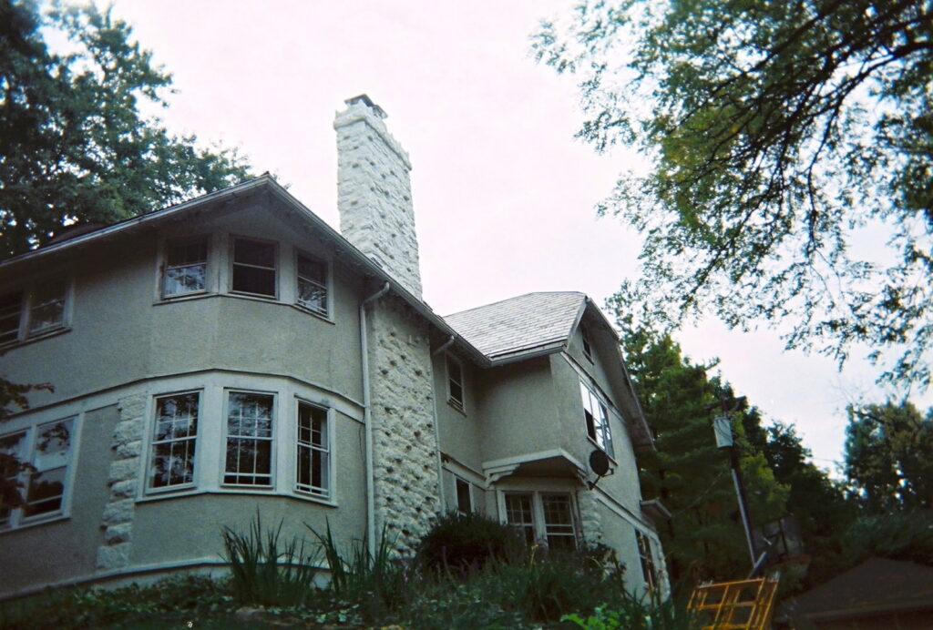 A finished stone chimney exterior on a residential home by Centerville Pipestone Chimney Services LLC in Dayton, OH.