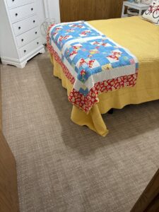 Newly installed wall-to-wall carpet in a cozy bedroom by Bell Carpet and Floors, Inc. in Wichita, KS.