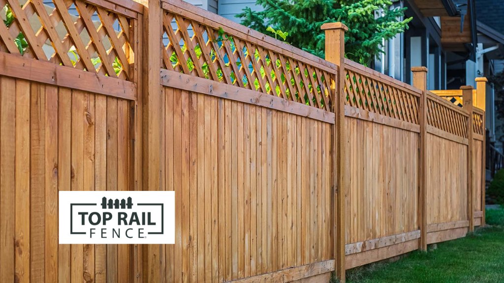 A beautifully installed wood fence with a decorative lattice top by Top Rail Fence Des Moines in West Des Moines, IA.