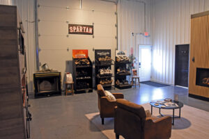 A wide view of the fireplace display area in the showroom of Spartan Heating, Cooling and Fireplaces in Cedar Rapids, IA