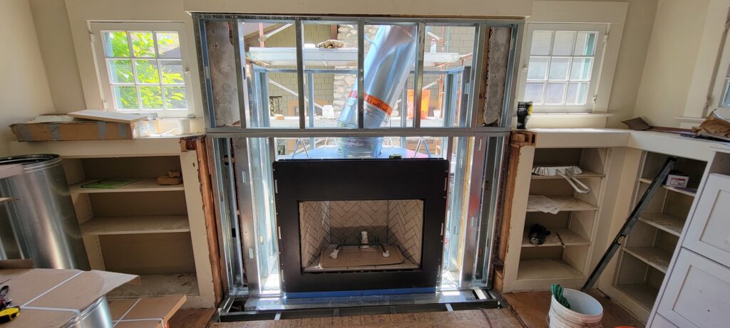 Interior view of a fireplace flue installation with metal framing during a project by The Chimney Guy in Los Angeles, CA.