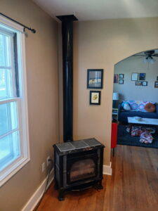 A newly installed fireplace stove with a flue pipe by Utah Mechanical Heating and Air Conditioning in South Ogden, UT.