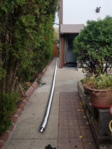 A long flexible HVAC duct pipe laid out for installation by HVAC Royal Service Inc in Chicago, IL.