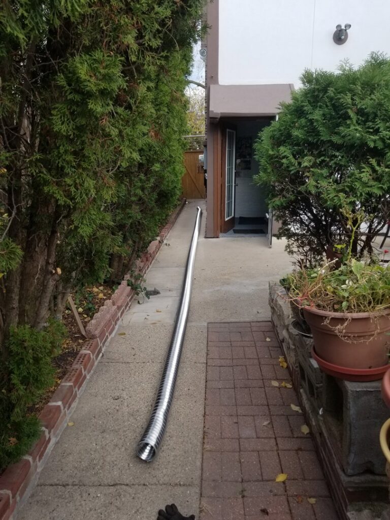 A long flexible HVAC duct pipe laid out for installation by HVAC Royal Service Inc in Chicago, IL.