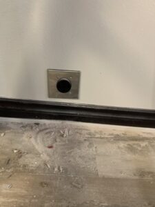 A metal floor electrical or data port installed by Your Electrician in Yakima, WA.