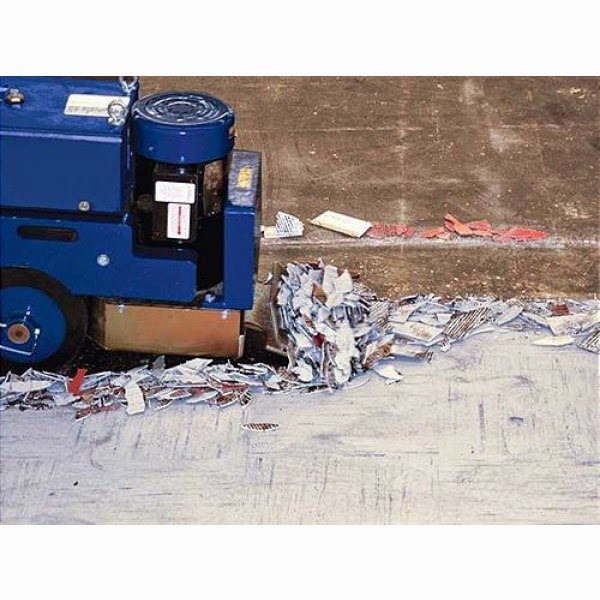 A floor removal machine efficiently removing old vinyl tiles at a job site for Clean Site Flooring Removal in Sacramento, CA.