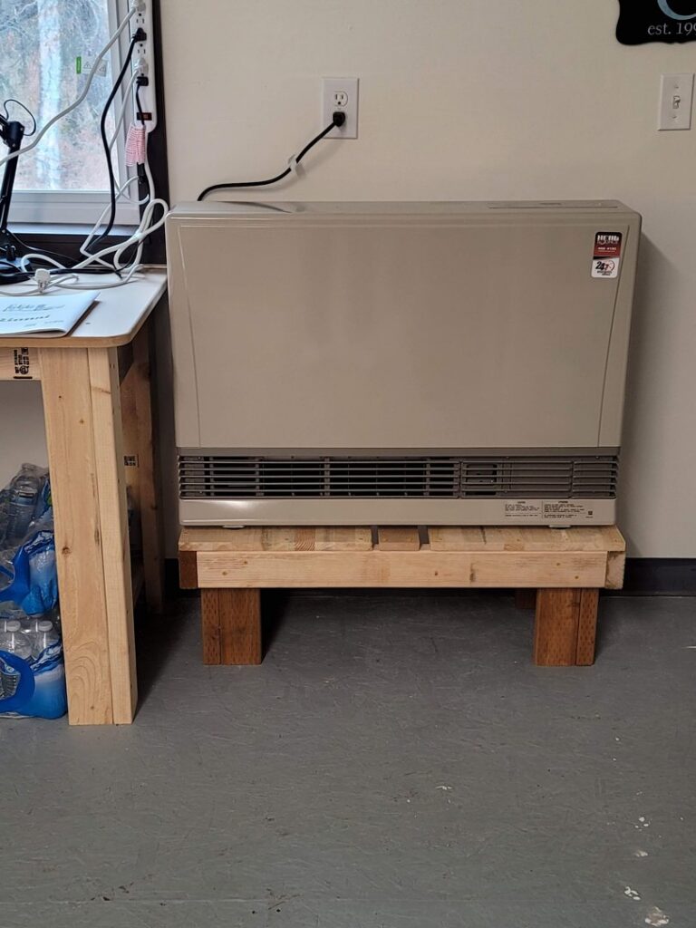 A floor-standing heating unit, typical of HVAC systems serviced by HeatSource Mechanical in Wasilla, AK.