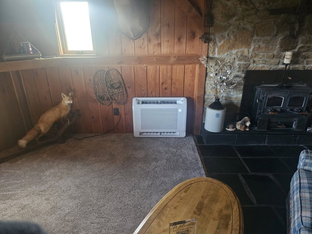 A floor-standing heating unit installed in a living space by T. D'Albora Heating and Cooling in Erie, PA.