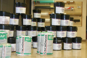 Various flooring adhesives, primers, and subfloor preparation compounds at East Bay Supply Co. in Birmingham, AL.
