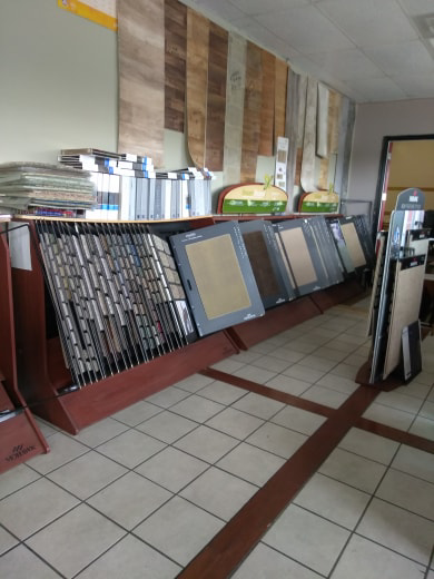 Various flooring and carpet sample displays in the showroom of The Carpet Plaza in Bakersfield, CA