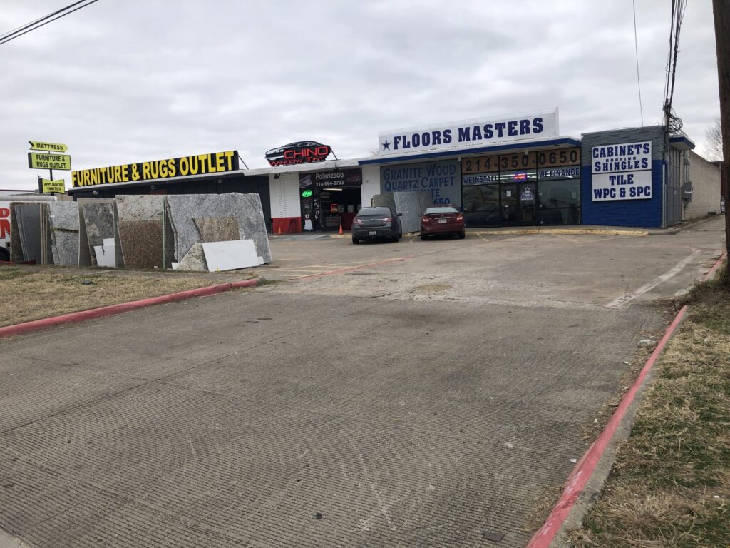 A wide view of the flooring and carpet showroom at SurfacePros in Austin, TX, showcasing various options.