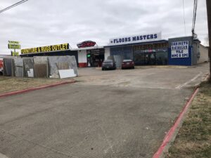 A wide view of the flooring and carpet showroom at SurfacePros in Austin, TX, showcasing various options.