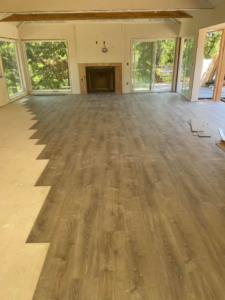 Laminate or vinyl plank flooring installation in progress by Carpet Club in Escondido, CA