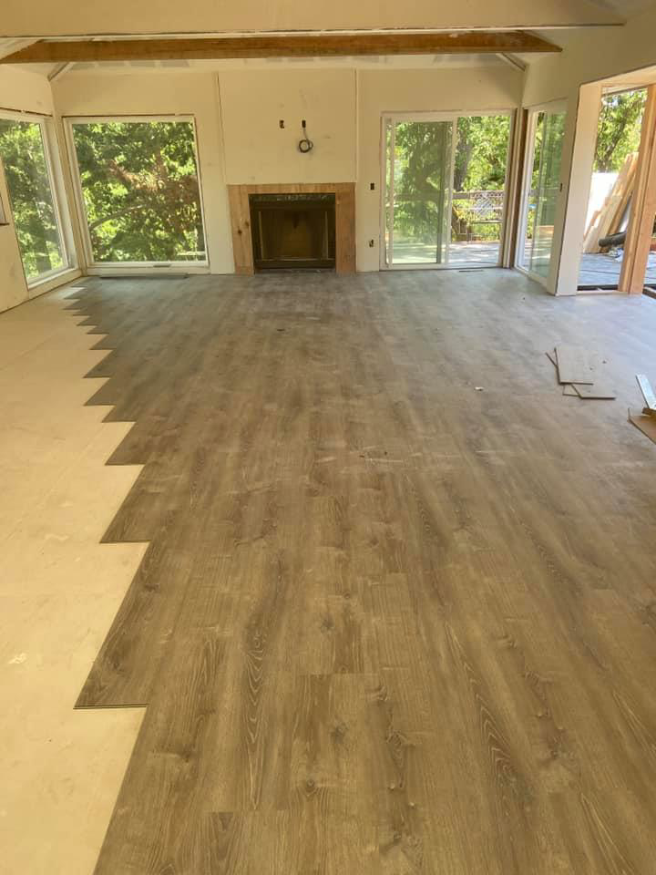 Laminate or vinyl plank flooring installation in progress by Carpet Club in Escondido, CA