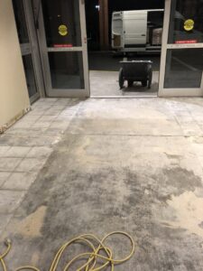 Concrete subfloor after old flooring removal, prepared for new installation by Grade A Flooring in Bronx, NY.