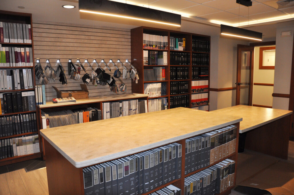 An organized showroom displaying a wide selection of flooring samples at Capital Carpet & Flooring Specialists in Wilmington, MA