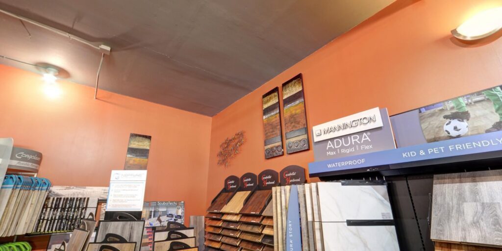 A wide view of the flooring showroom featuring carpet samples at Home 360 Flooring Company in Columbus, NE.