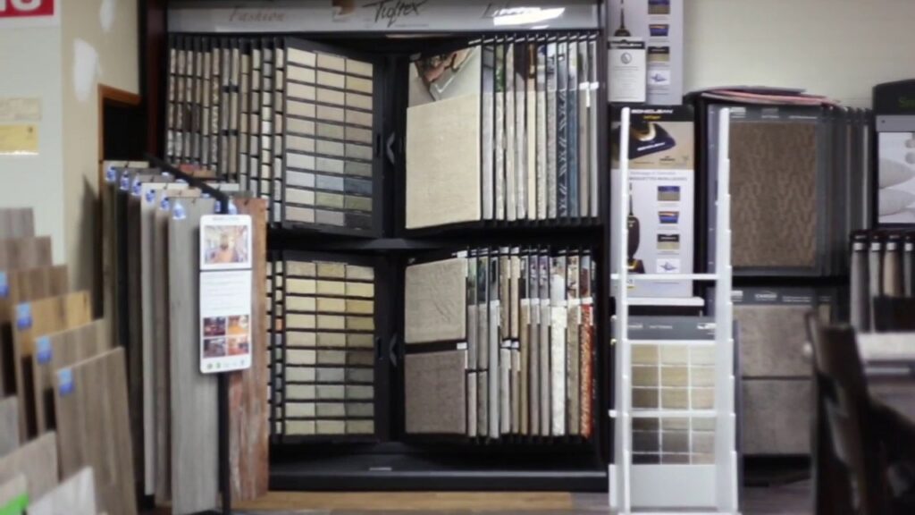 Interior view of the flooring showroom displaying carpet, tile, and wood samples at Anaheim Carpet and Flooring in Anaheim, CA.